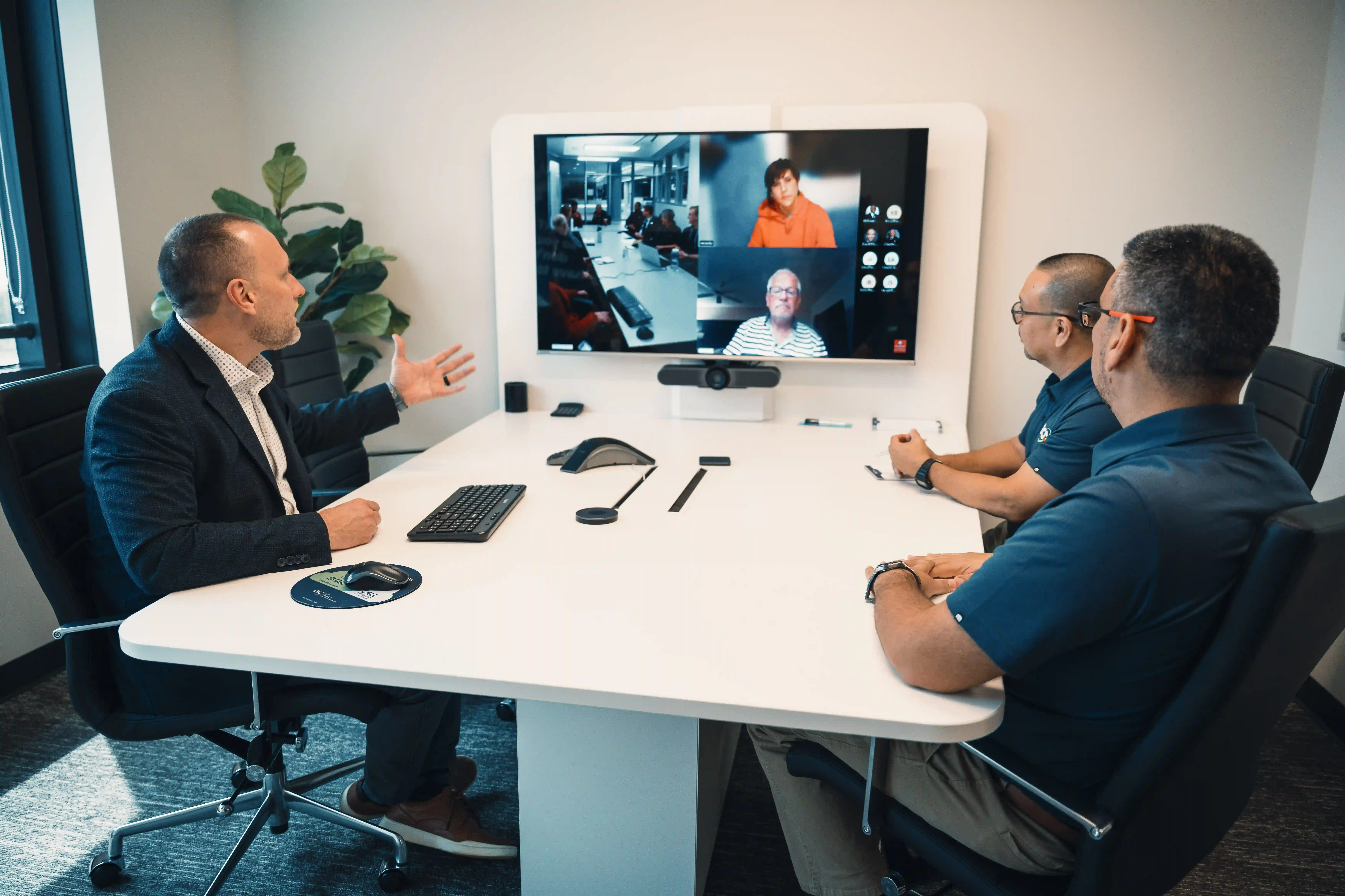 BCA team members participate in a hybrid meeting with remote partners, illustrating seamless collaboration and support through co-managed IT services.