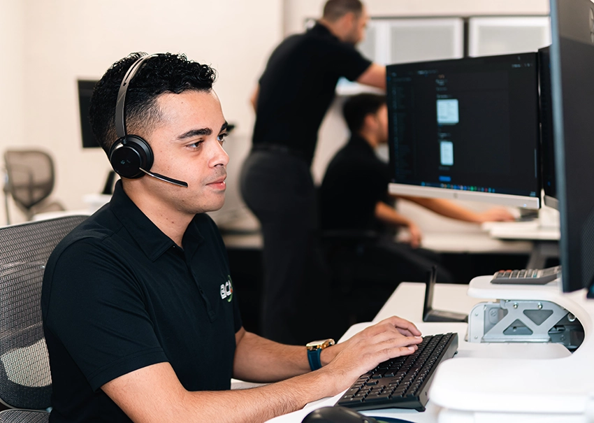 BCA IT help desk specialist documenting a support request.
