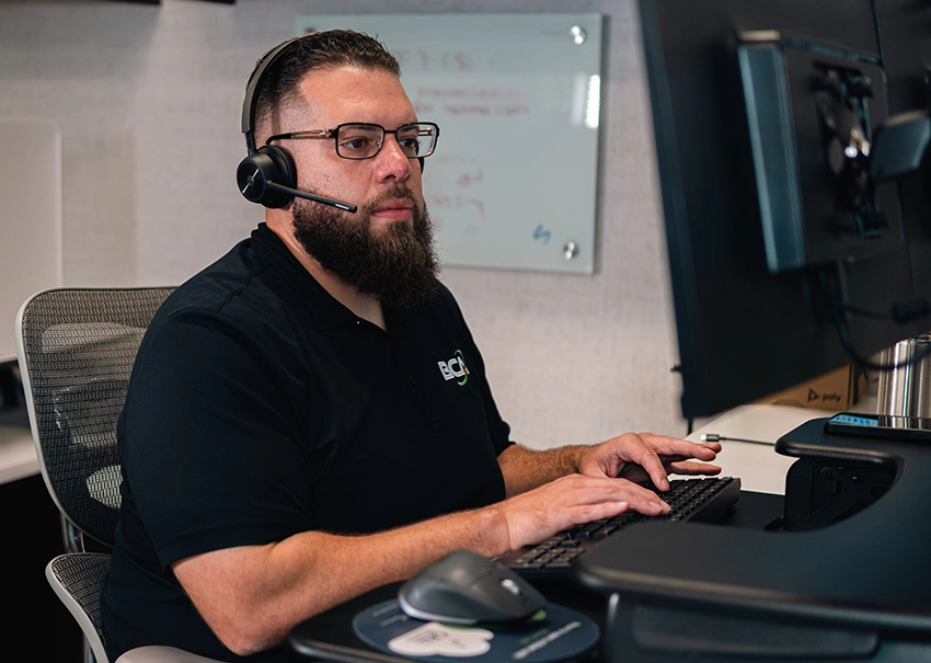 BCA IT support engineer working to resolve a remote technical issue.